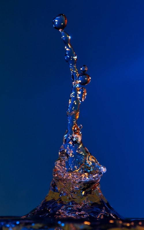 a drop of water impacting a mass of water