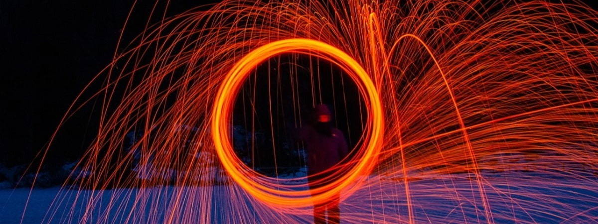 Image of circular orange coloured light experience controlled by an individual